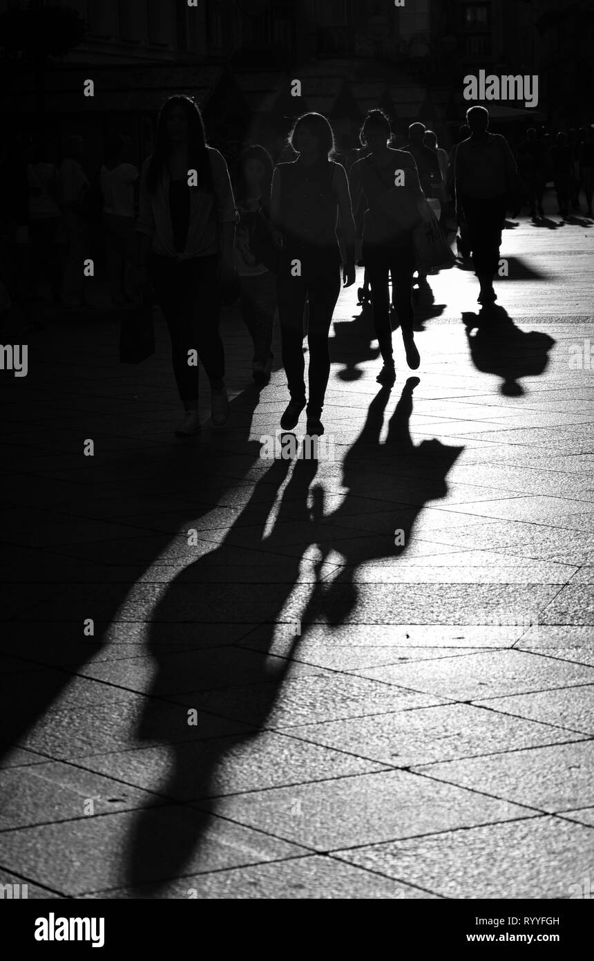 Walking people in the city, silhouettes, black and white street photography Stock Photo