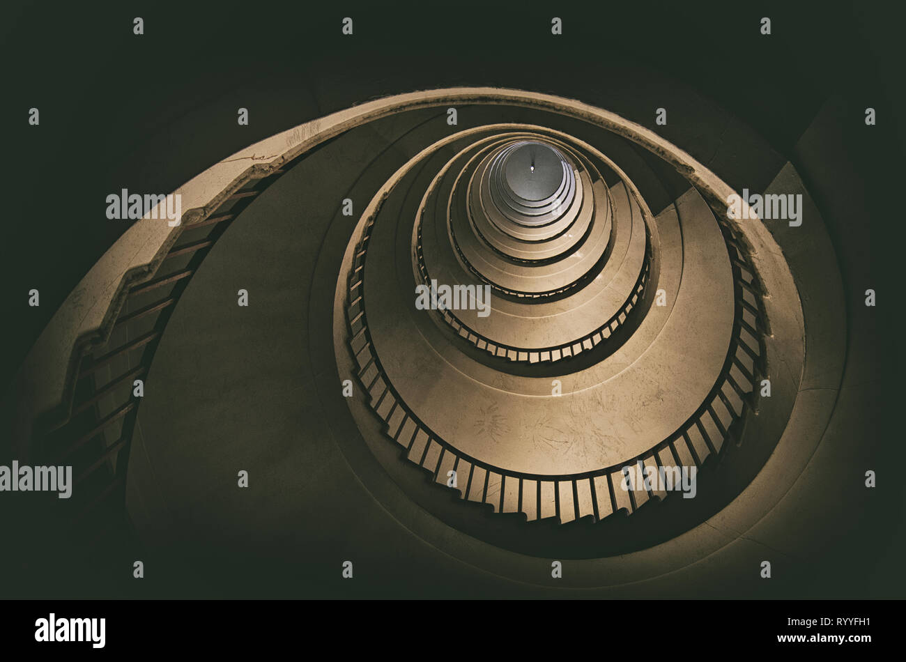 golden stairs, spiral staircase in an old building, abstract architecture wallpaper Stock Photo