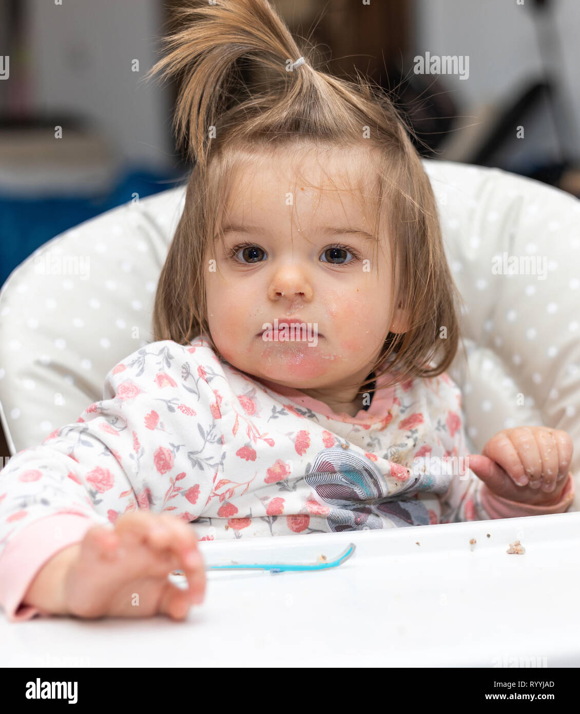 Sweet 17-Months Old Baby Girl Eating With Hands And Plastic Spoon. Head Shot. Indoor Photography Stock Photo - Alamy Sweet 17-Months Old Baby Girl Eating With Hands And Plastic Spoon. Head Shot. Indoor Photography Stock Photo - Alamy