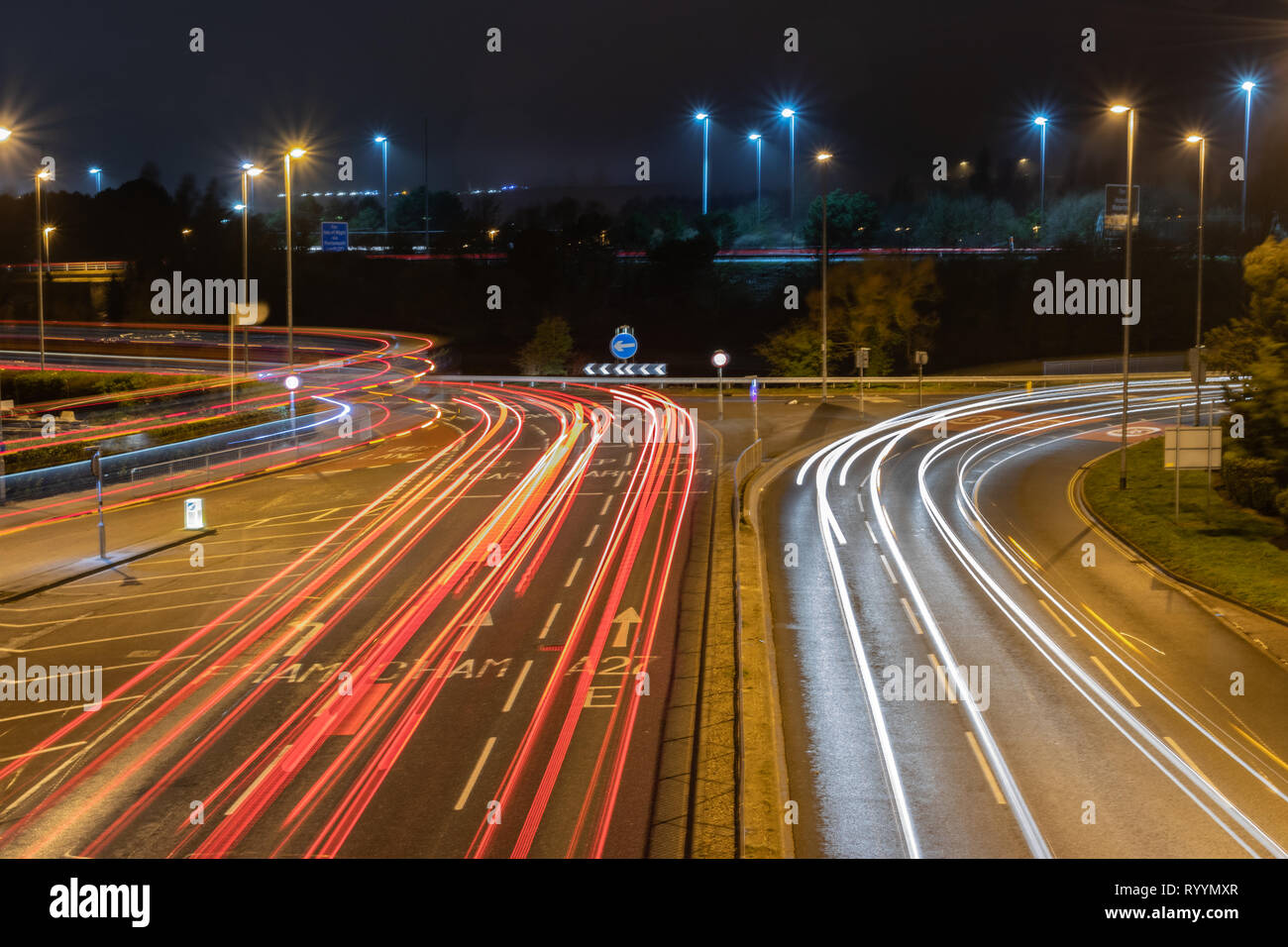 traffic light trails at night in Portsmouth Stock Photo