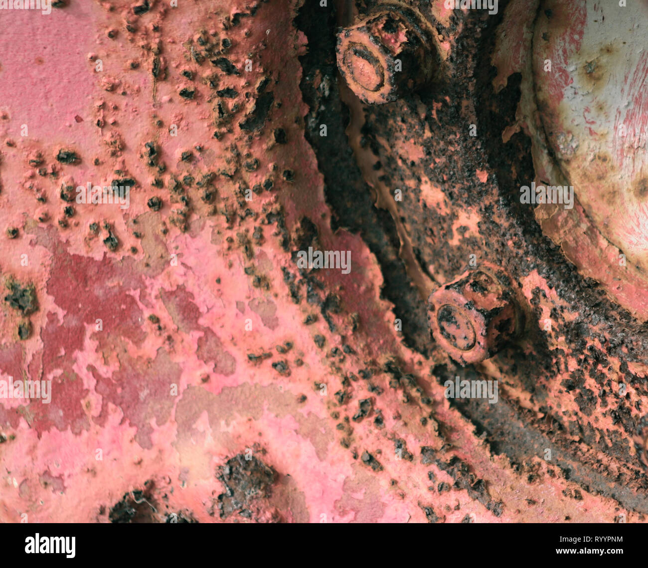 Flaking paint on a rusted tractor wheel Stock Photo Alamy