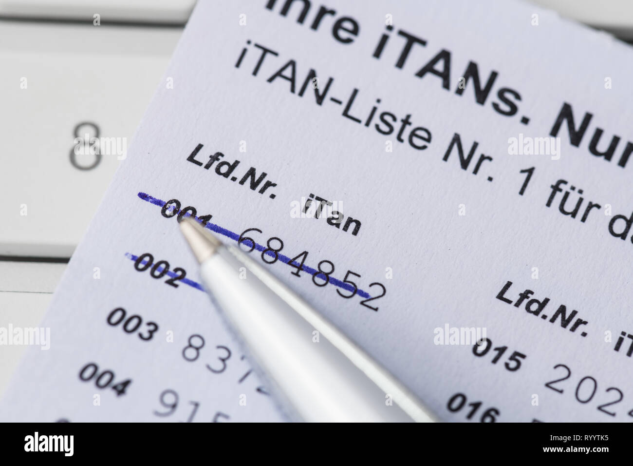 iTan-list with pen and computer keyboard Stock Photo
