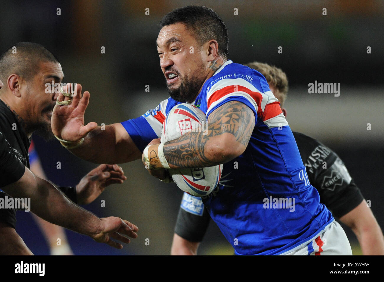 Hull, UK, 15 3 2019. 15 March 2019. KCOM Stadium, Hull, England; Rugby League Betfred Super League, Hull FC vs Wakefield Trinity; Tinirau Arona fends off the Hull FC defence. Dean Williams Credit: Dean Williams/Alamy Live News Stock Photo