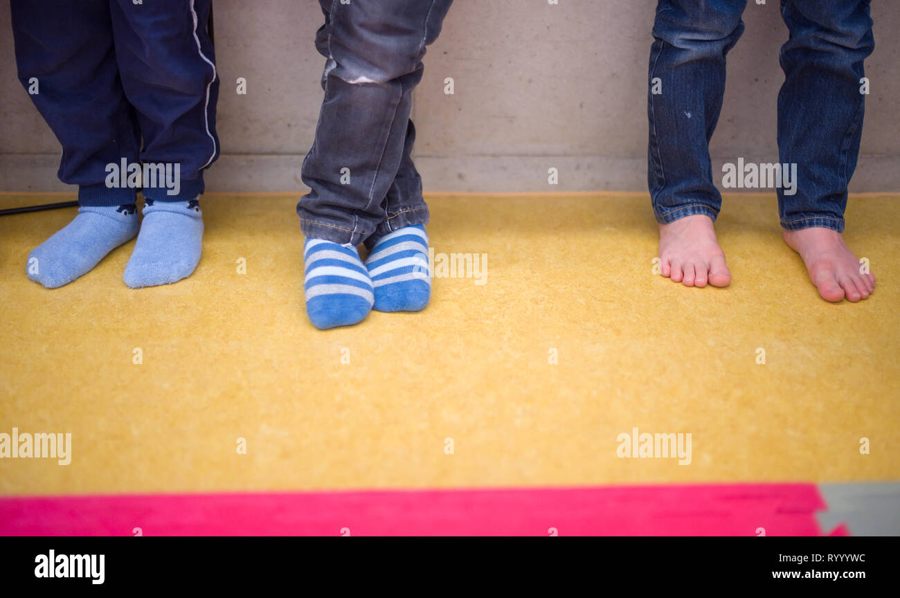 Three boys stand hi-res stock photography and images - Alamy