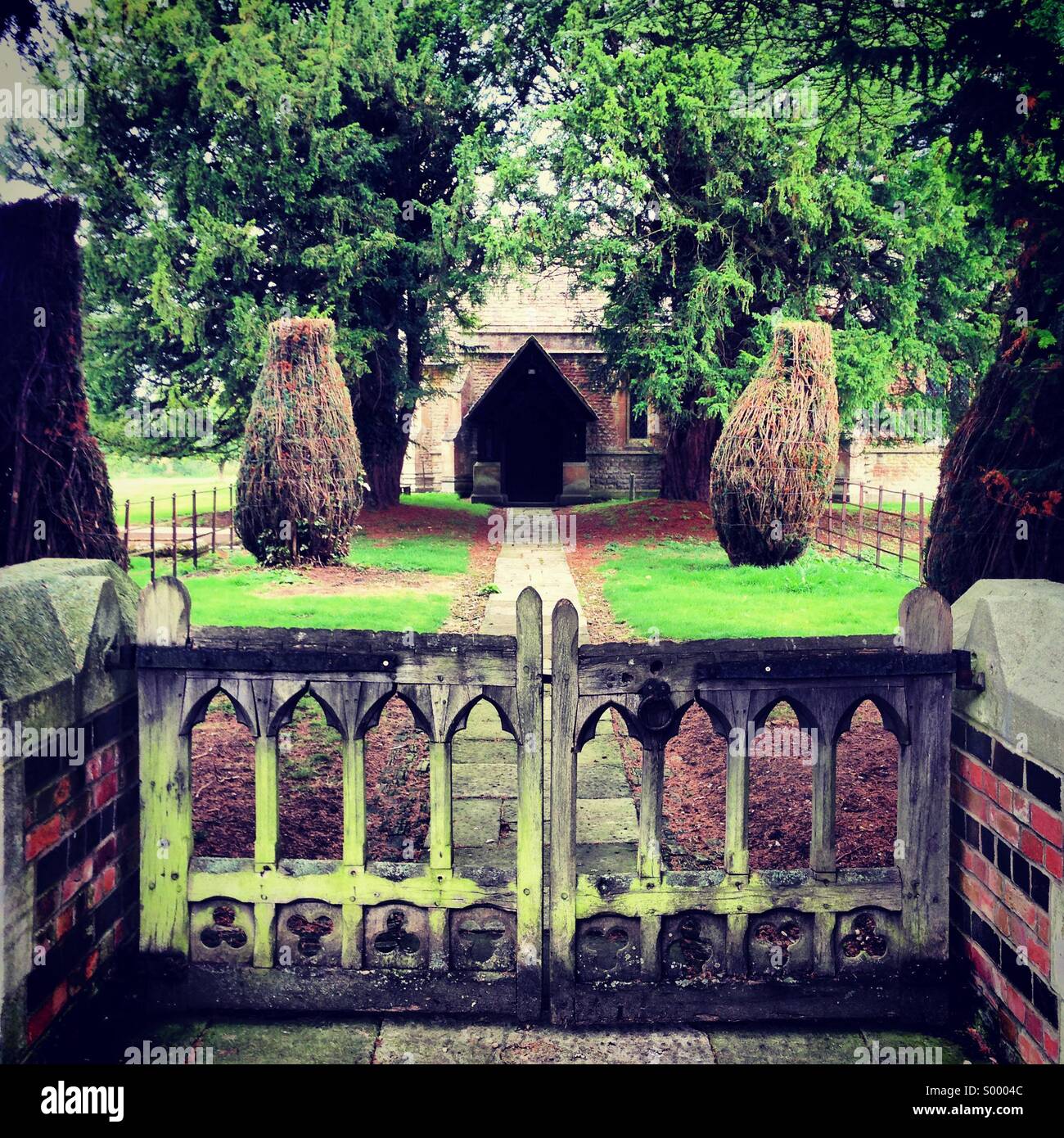 Gates leading to a pathway up to an old church, Oxfordshire - Smartphone Captured Stock Image