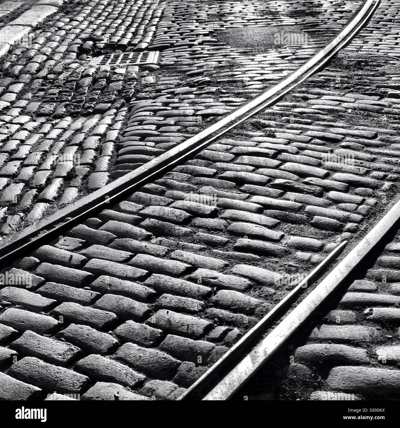 Old cobblestoned street with historic train tracks showing in the DUMBO neighborhood of Brooklyn, New York. Stock Photo