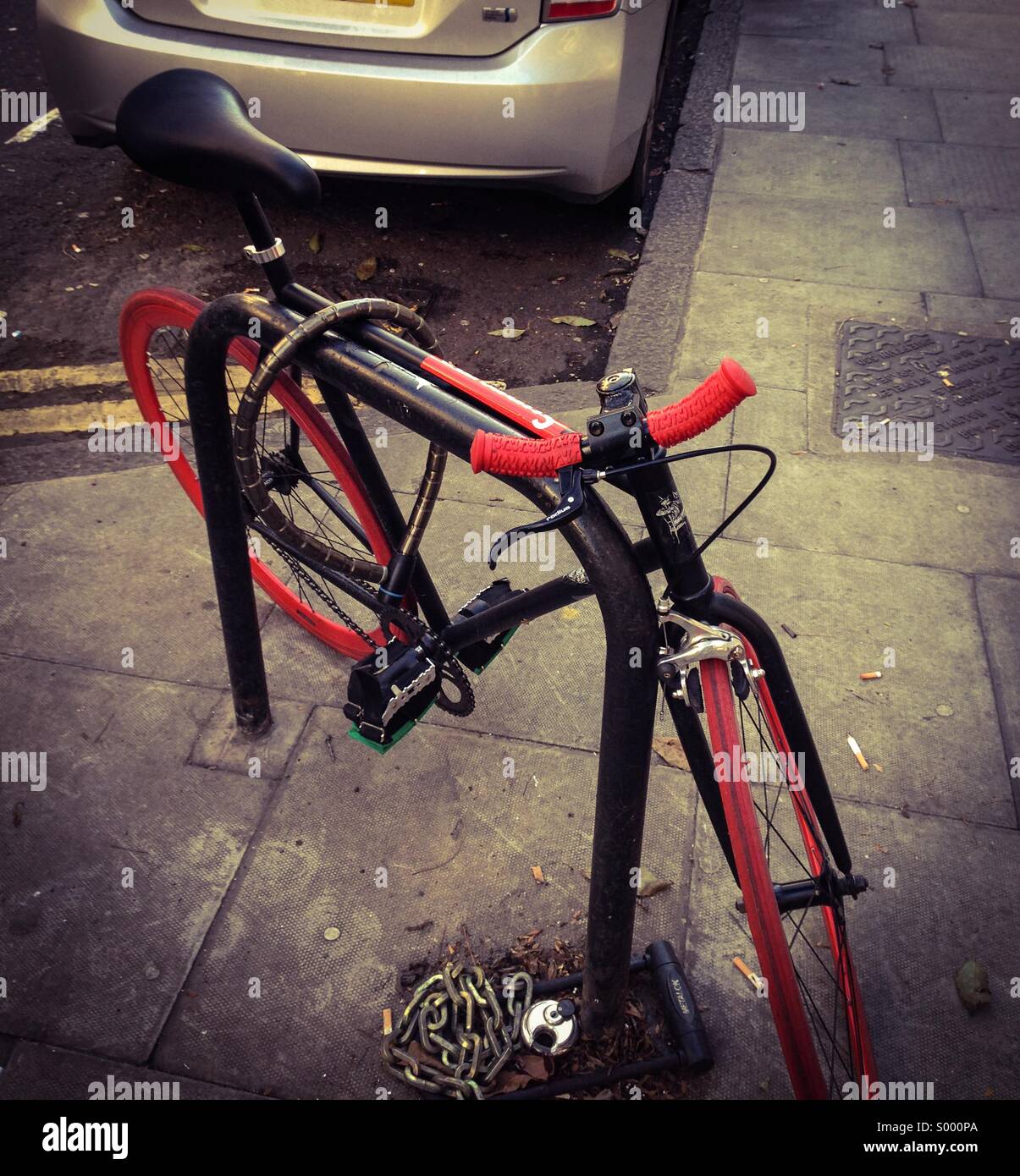 A 'fixie' bike locked up on a London Street Stock Photo