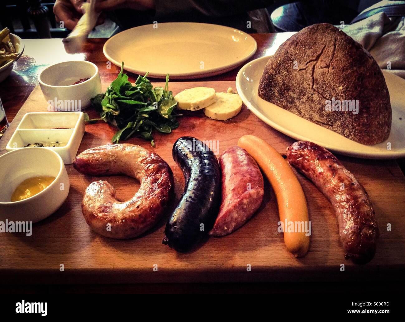 Sausage platter in the Old Red Cow pub Smithfield Stock Photo - Alamy