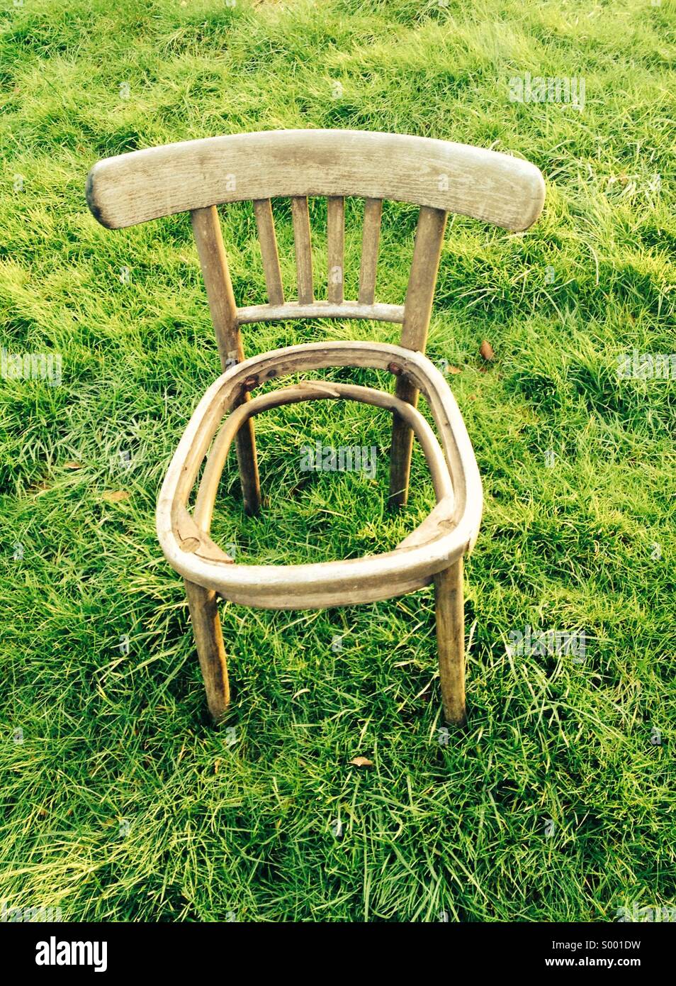 Empty chair, redundant wooden chair with missing seat Stock Photo Alamy