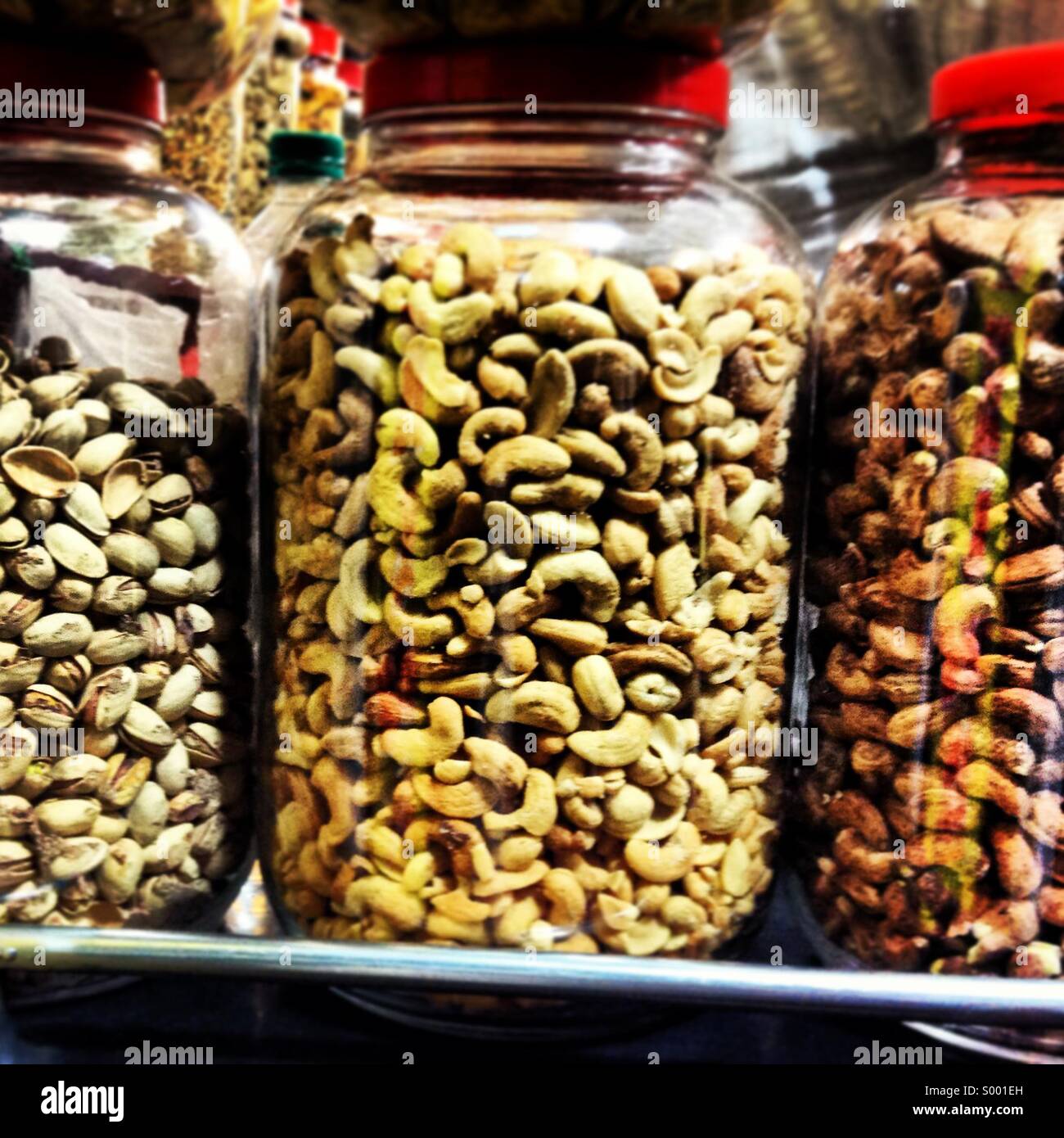 Dry fruits in glass jar displayed in a bakery Stock Photo Alamy