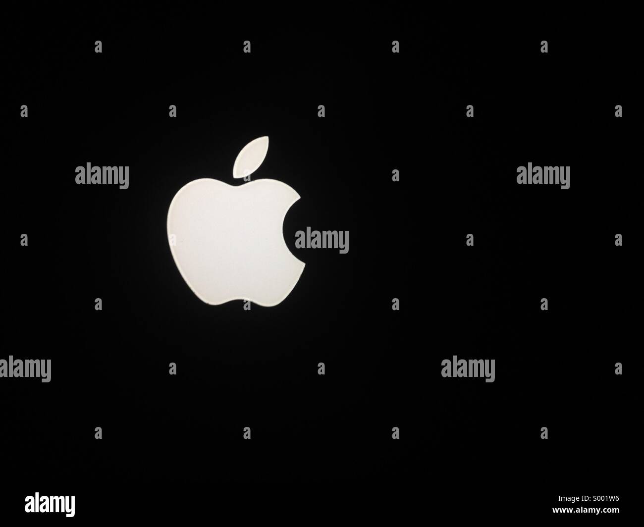 Apple logo on black background Stock Photo