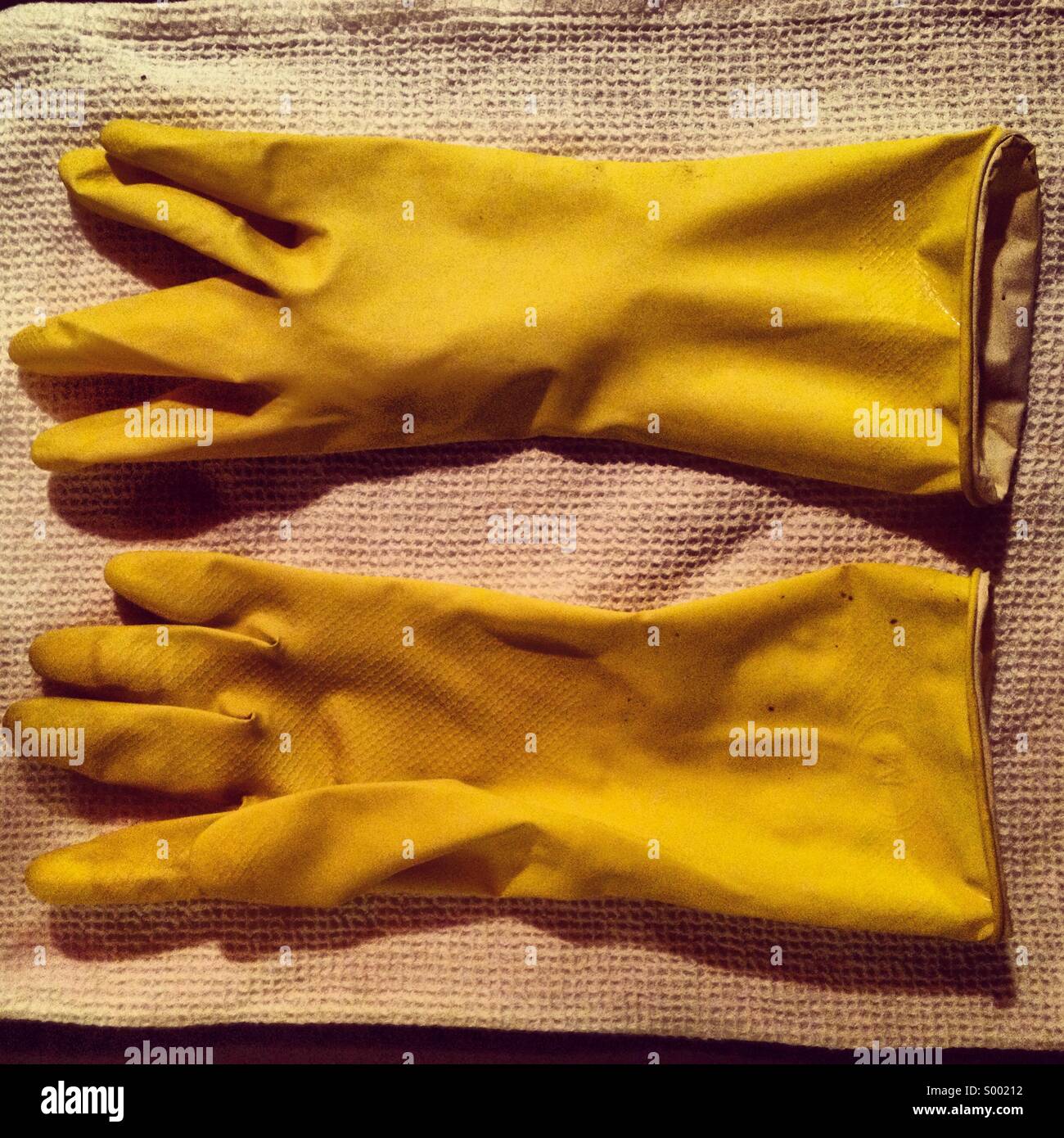 Dish washing rubber gloves Stock Photo