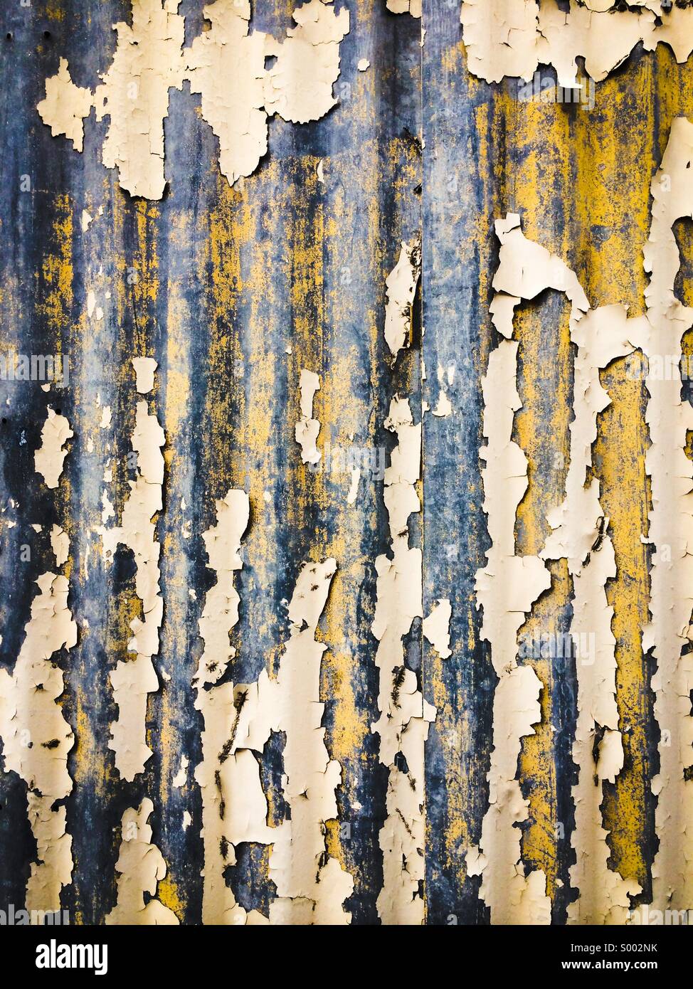 Paint peeling off corrugated steel wall - Smartphone Captured Stock Image