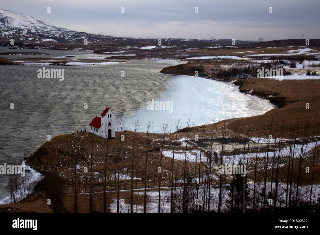Church on a hill beside a lake. - Smartphone Captured Stock Image