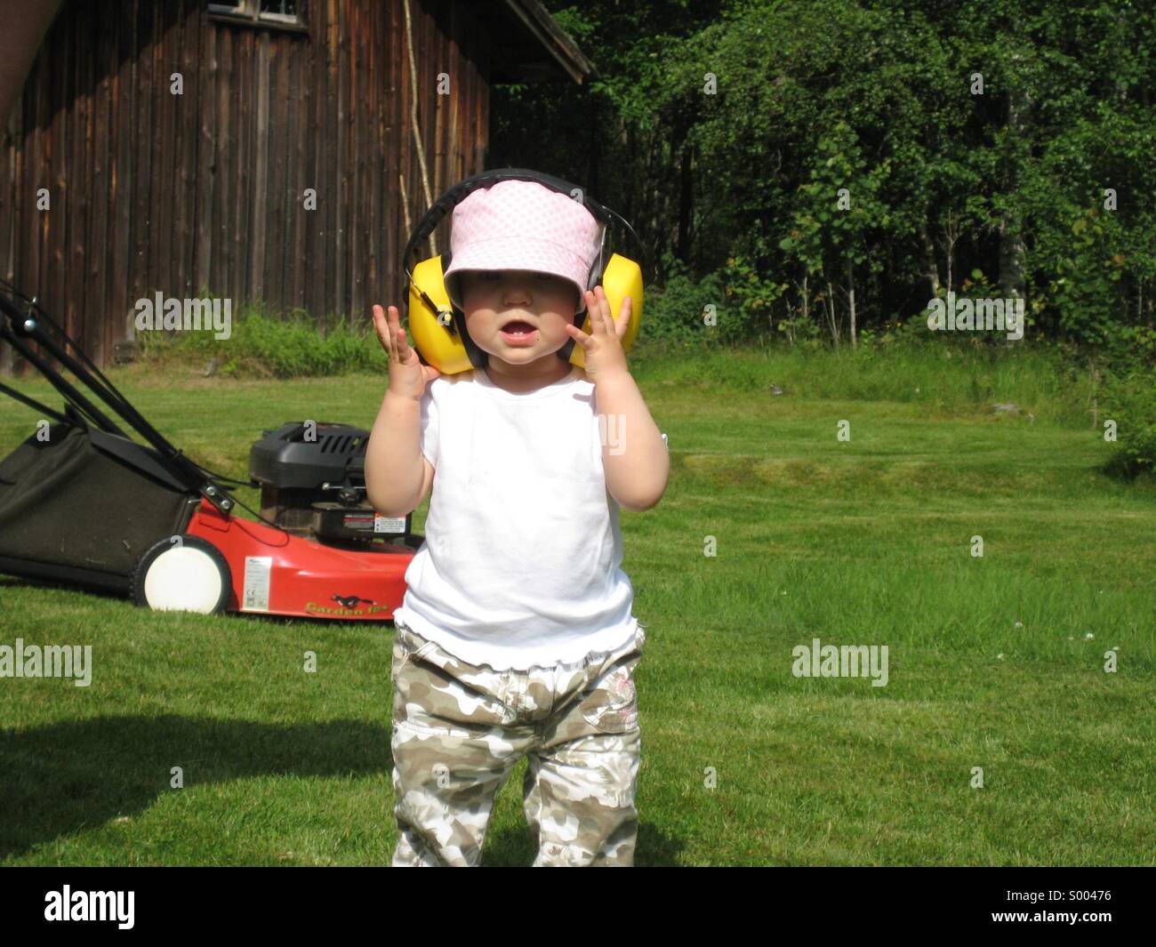 Child with ear muffs Stock Photo Alamy