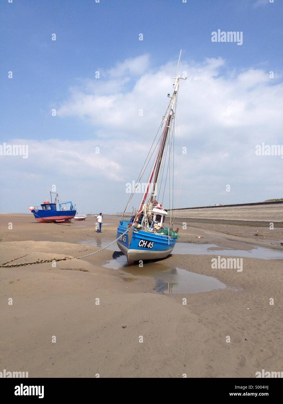 Sail boat at high tide, Wirral, UK Stock Photo