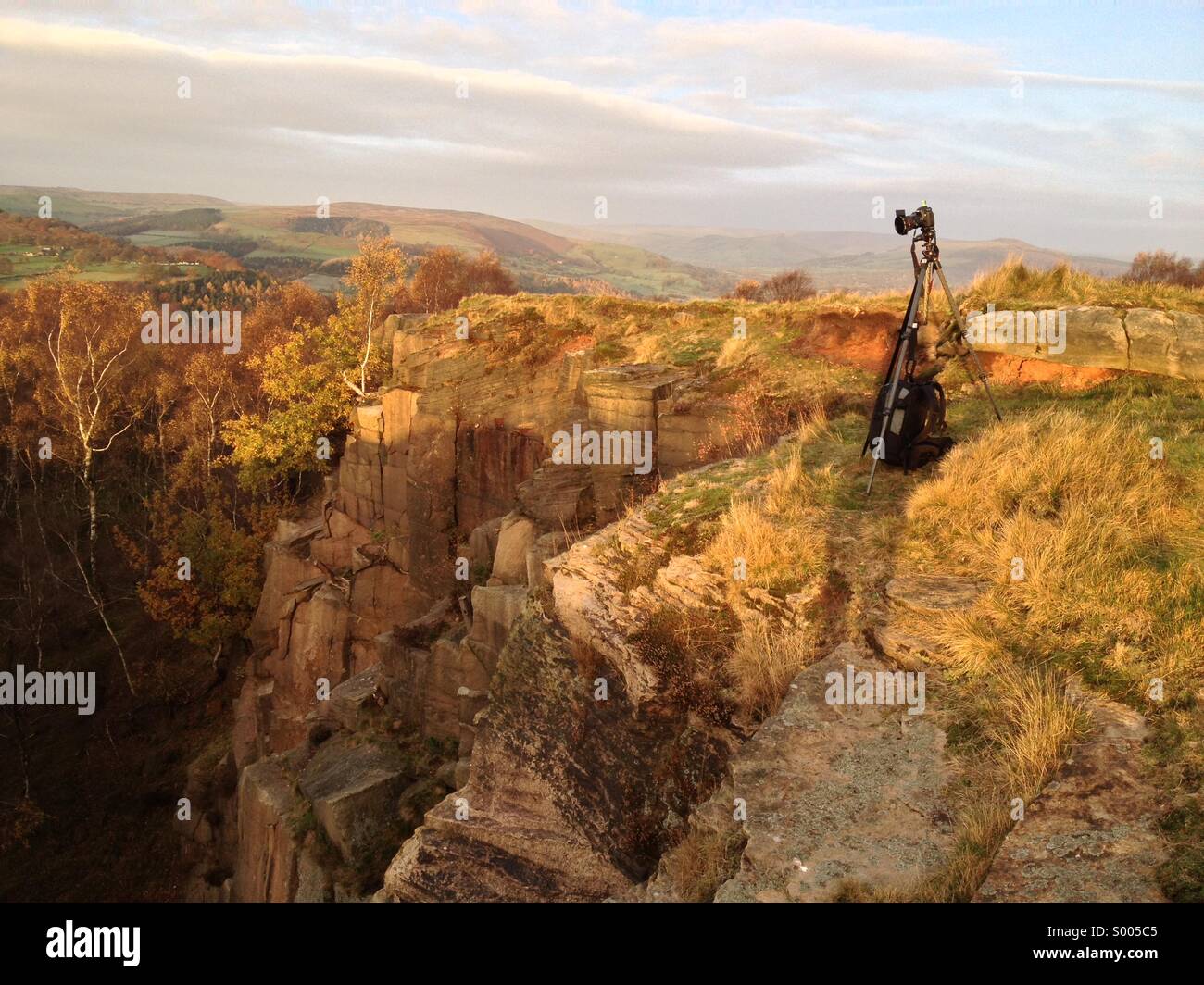 Camera and tripod set-up above Bole Hill Quarry in the Peak District Stock Photo