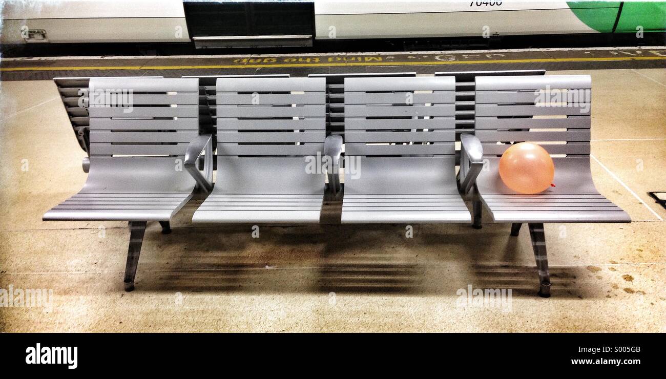 A balloon on a stainless steel bench at Victoria Train station Stock Photo