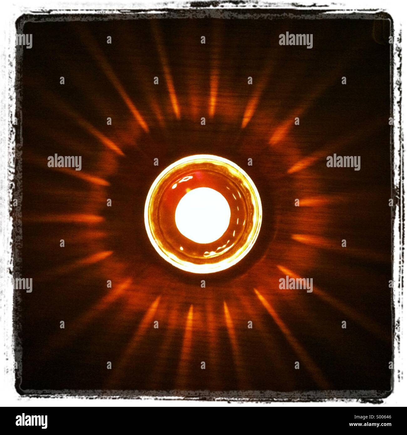 A tea light burning creating a pattern on the surface - Smartphone Captured Stock Image