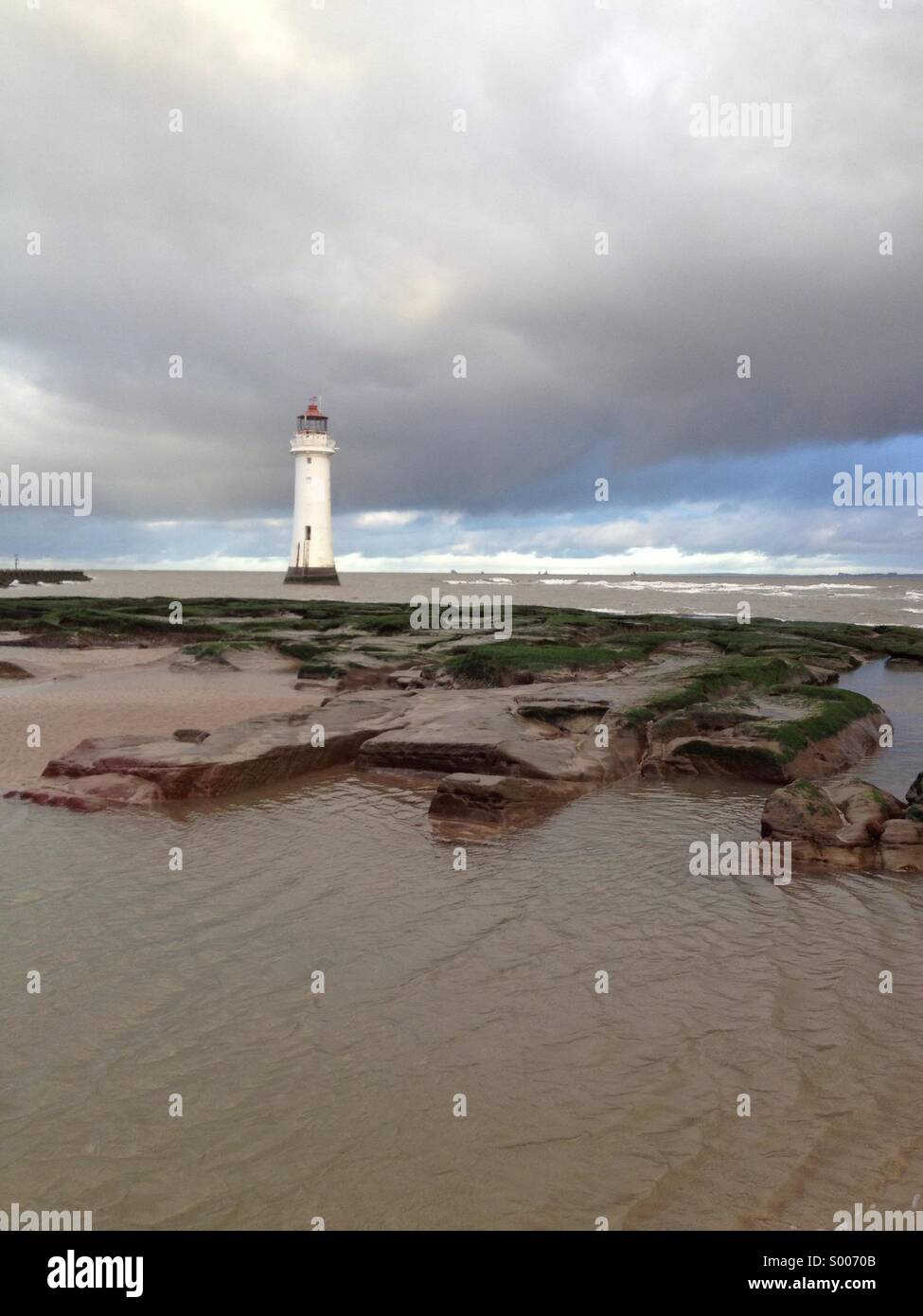 New Brighton lighthouse at low tide, Wirral, UK Stock Photo