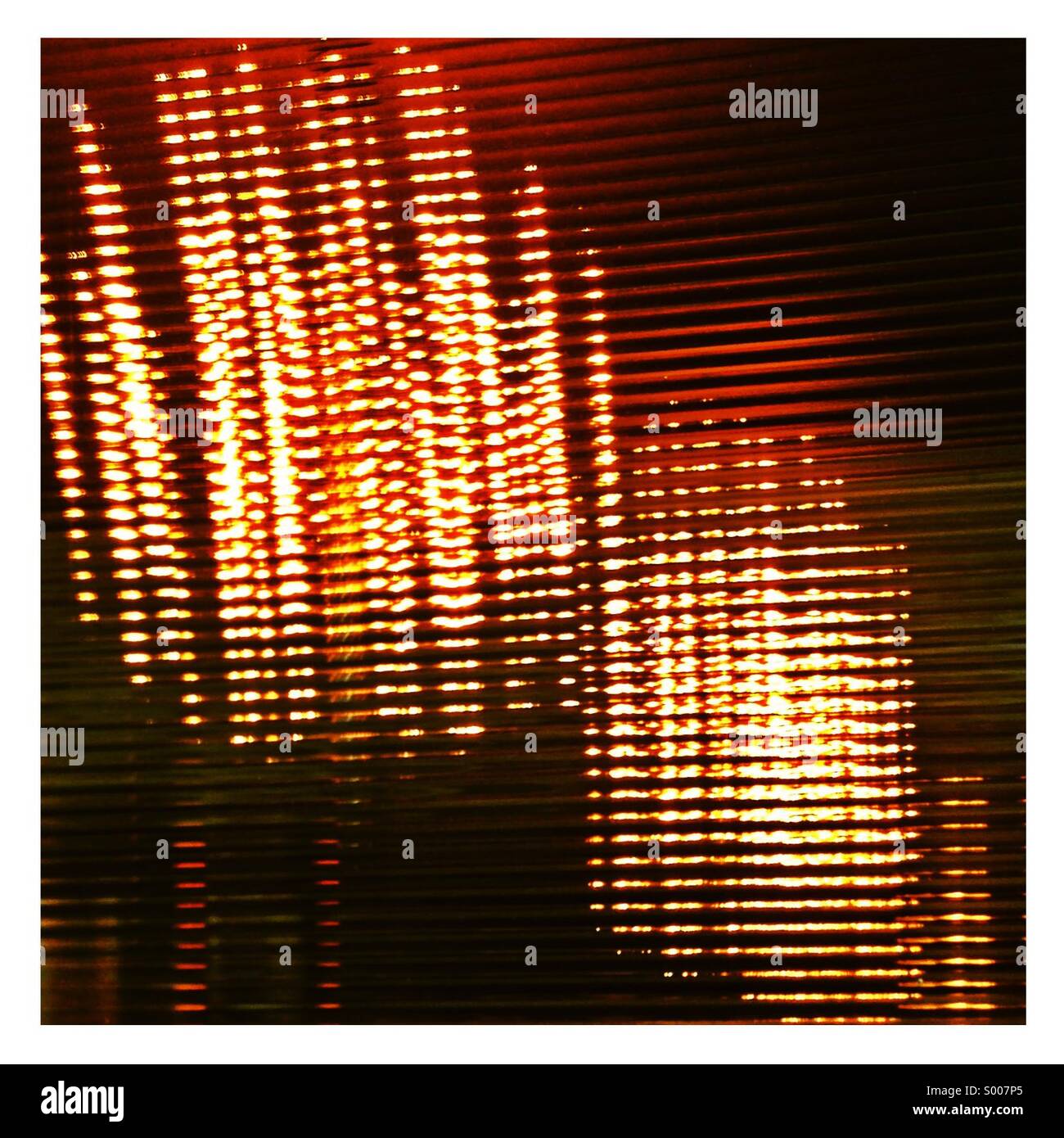Lights shining through a textured window - Smartphone Captured Stock Image