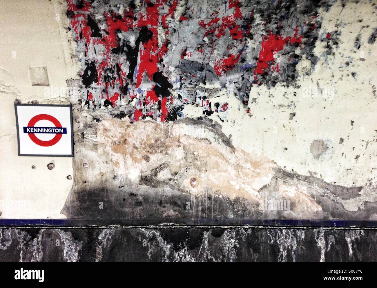 Kennington tube station after advertising posters have been cleaned off the tunnel wall - Smartphone Captured Stock Image