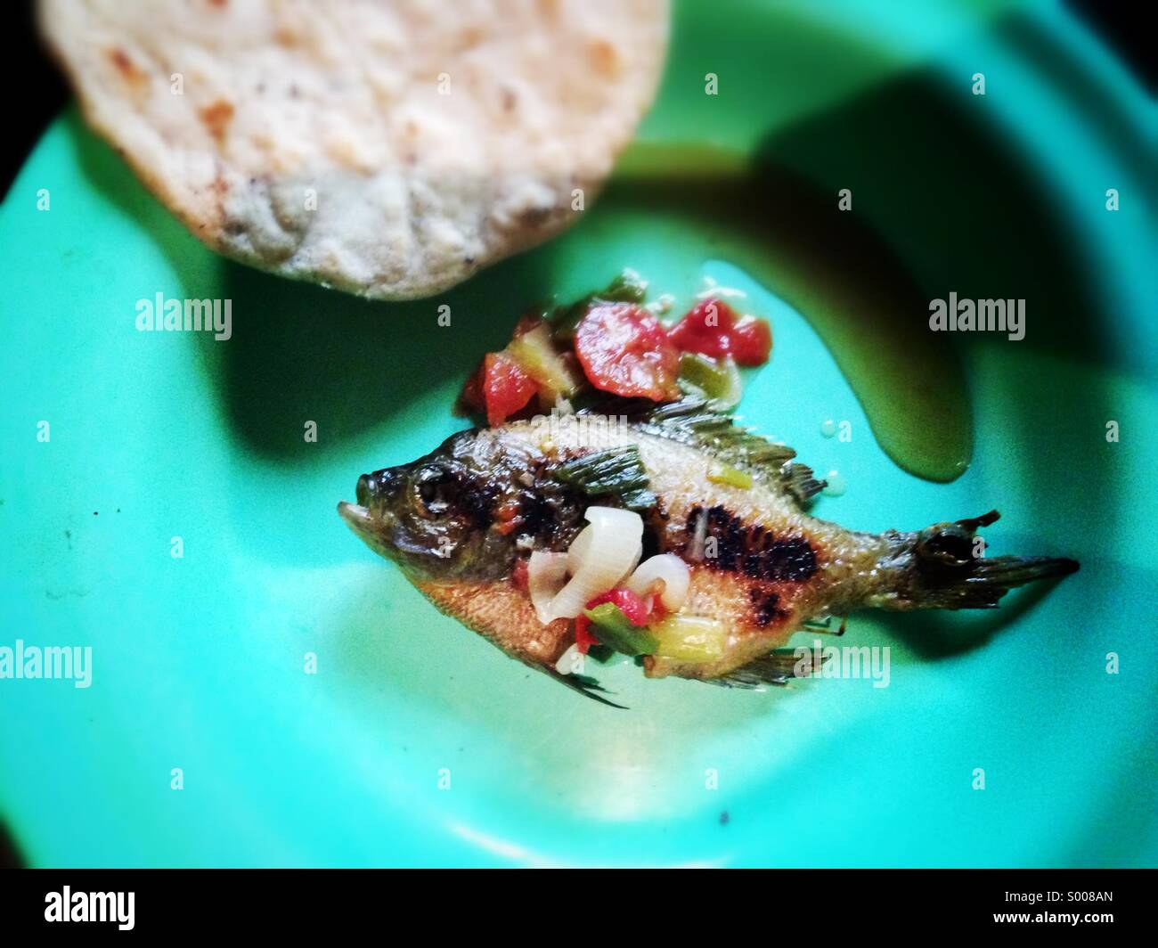 Simple fish and tortilla meal,Lake Atitlan, Guatemala Stock Photo