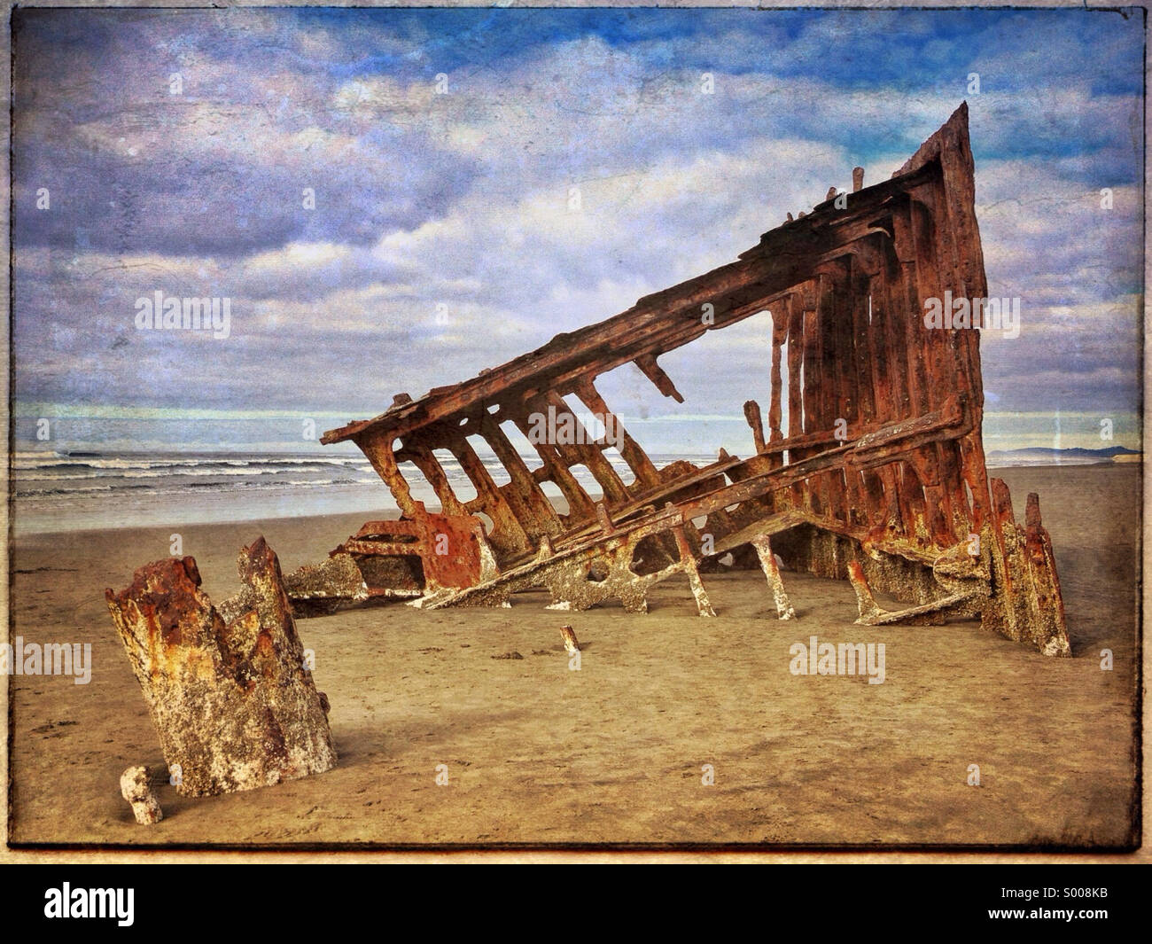The Wreck of the Peter Iredale rests on the shore in northern Oregon Stock Photo