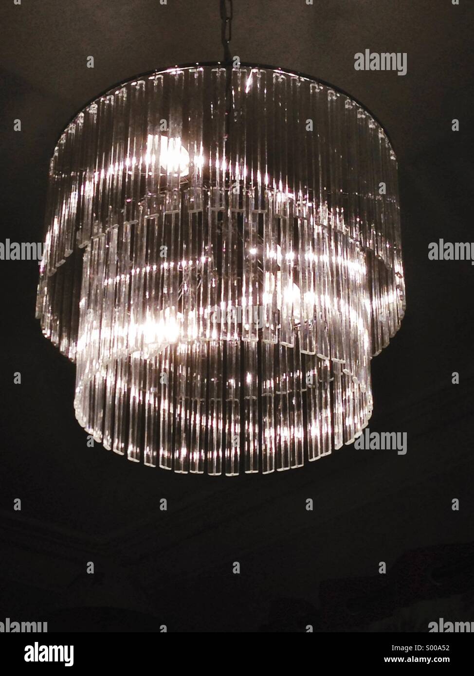 Light shining through a chandelier Stock Photo