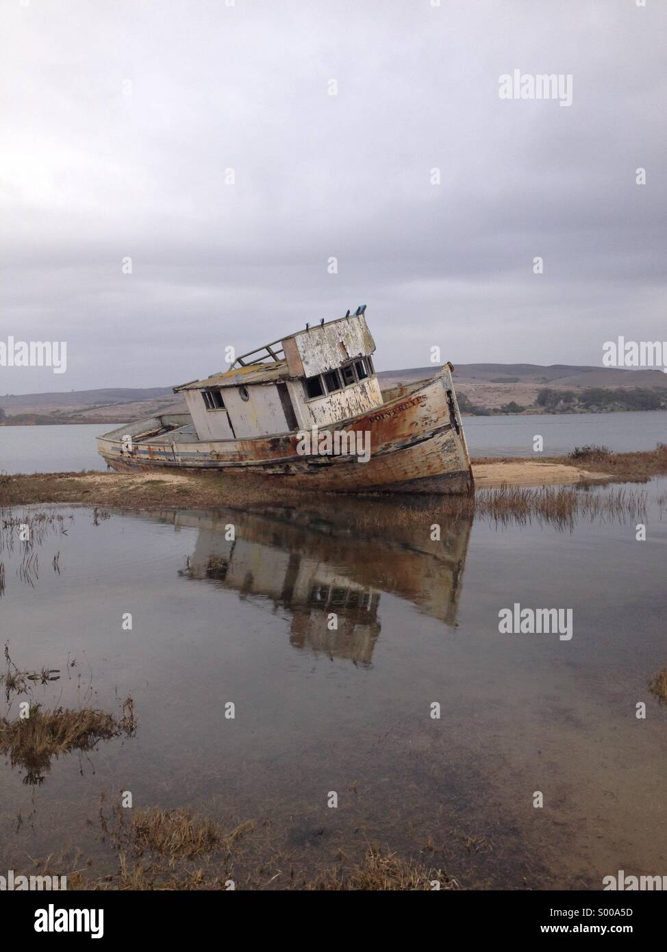 An abandoned boat washed ashore in Inverness, California Stock Photo