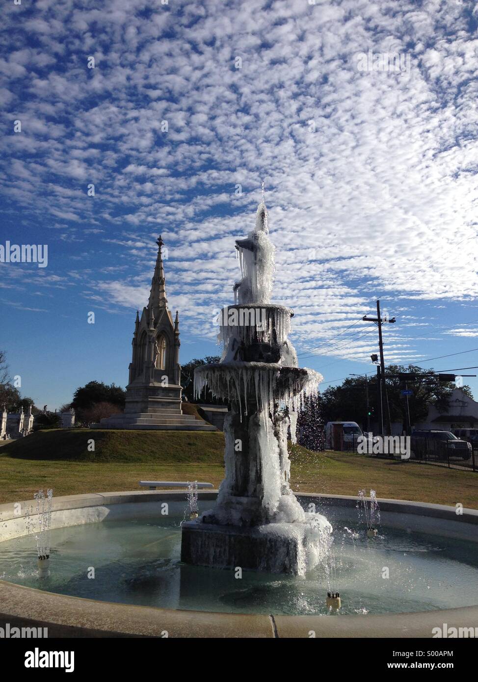 Frozen fountain in the New Orleans Greenwood Cemetery Stock Photo