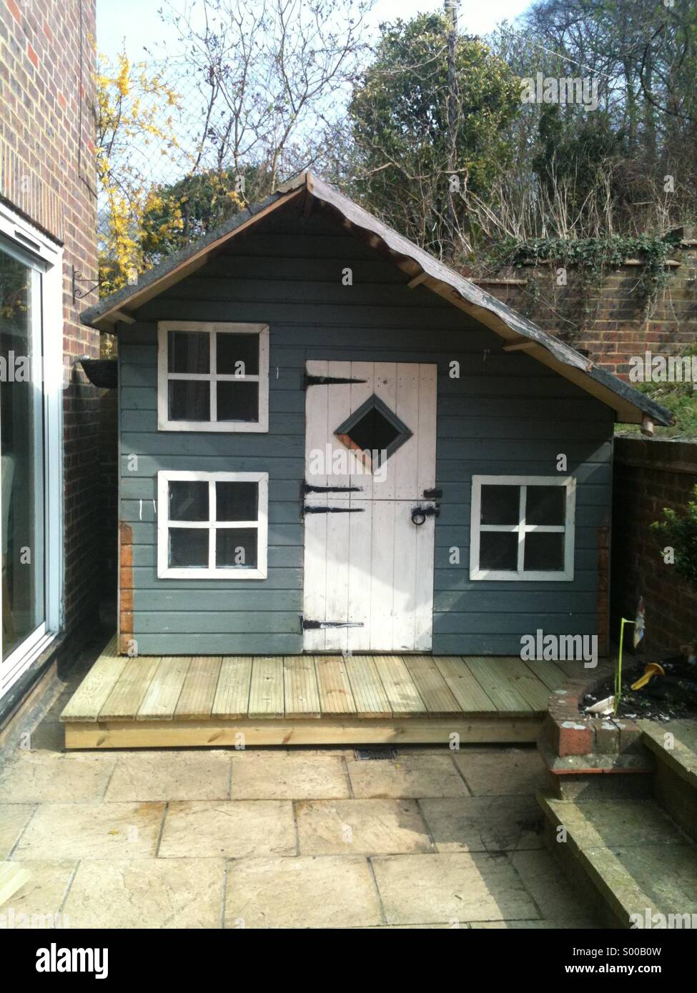 Child's playhouse on patio Stock Photo Alamy