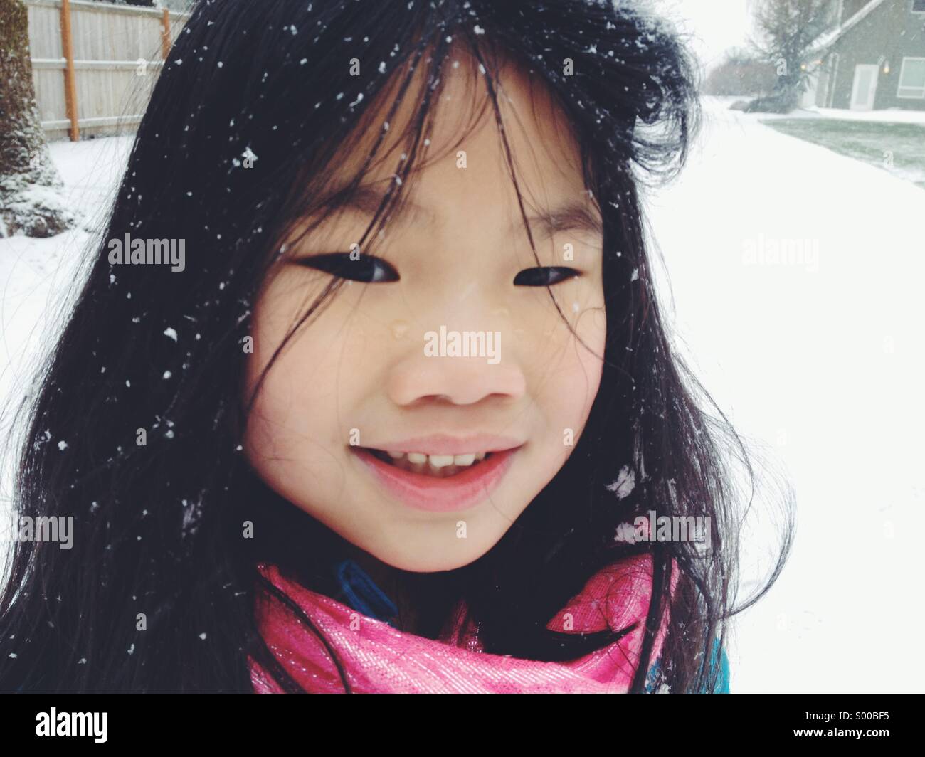 Young girl with snow in hair Stock Photo Alamy