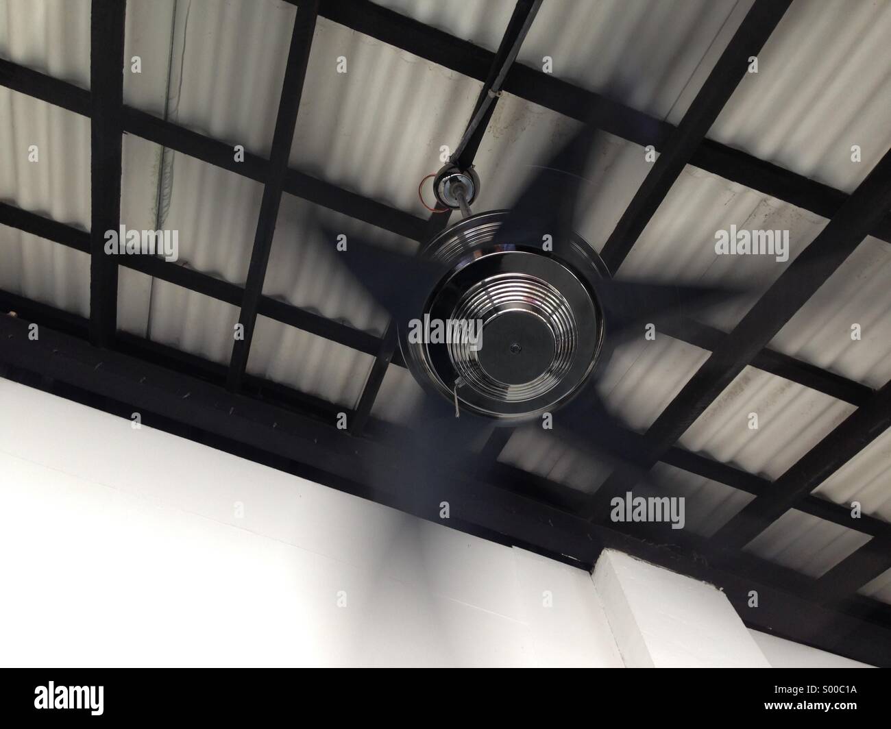 Spinning ceiling fan Stock Photo