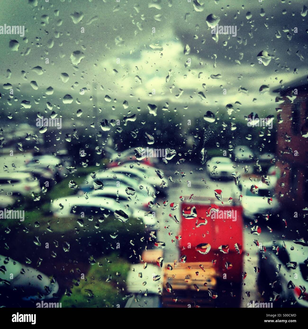 Rain outside the office window Stock Photo - Alamy