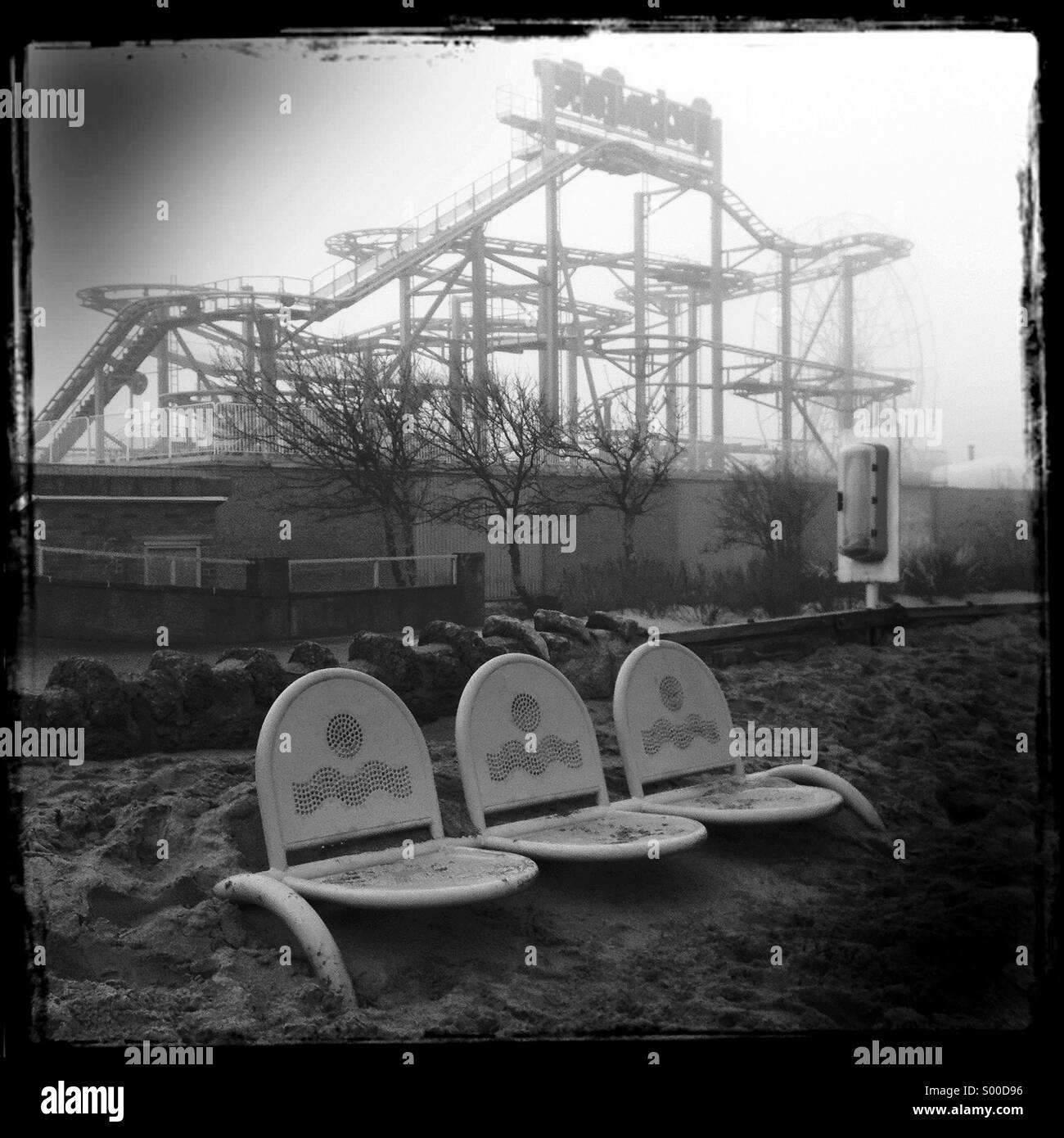 The fun fair at Skegness, England on a misty winter day. Stock Photo