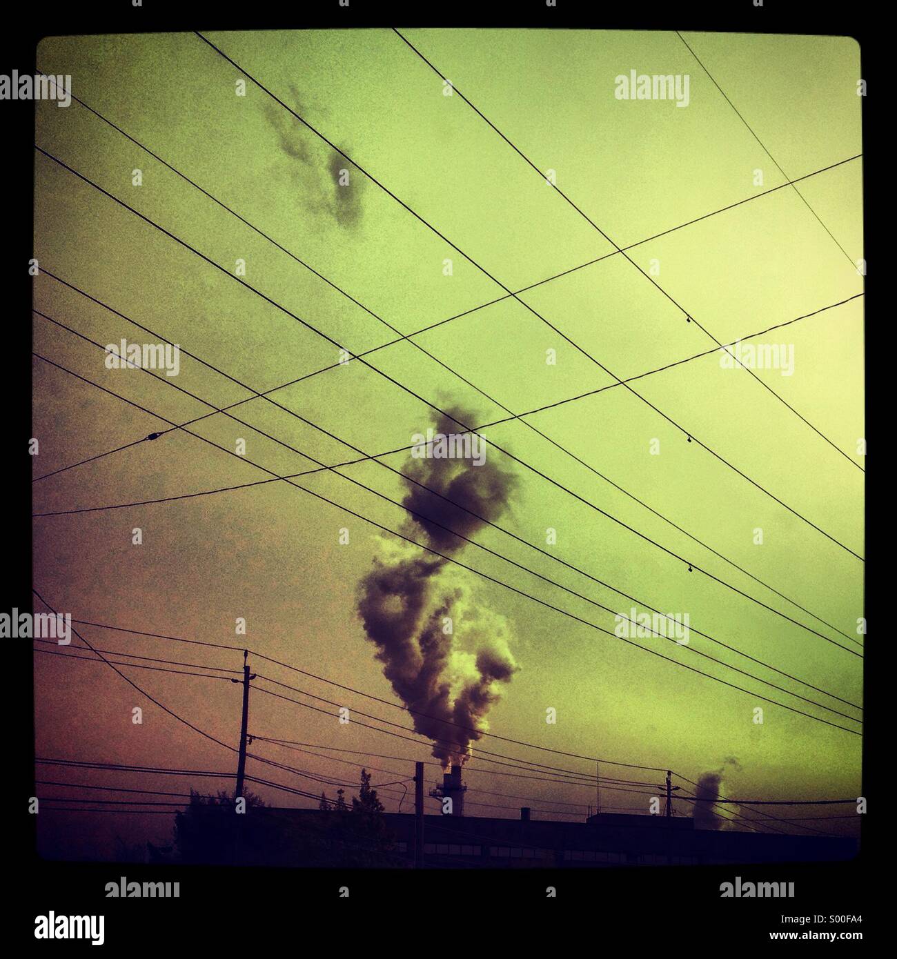 Plume of smoke rising from a factory Stock Photo