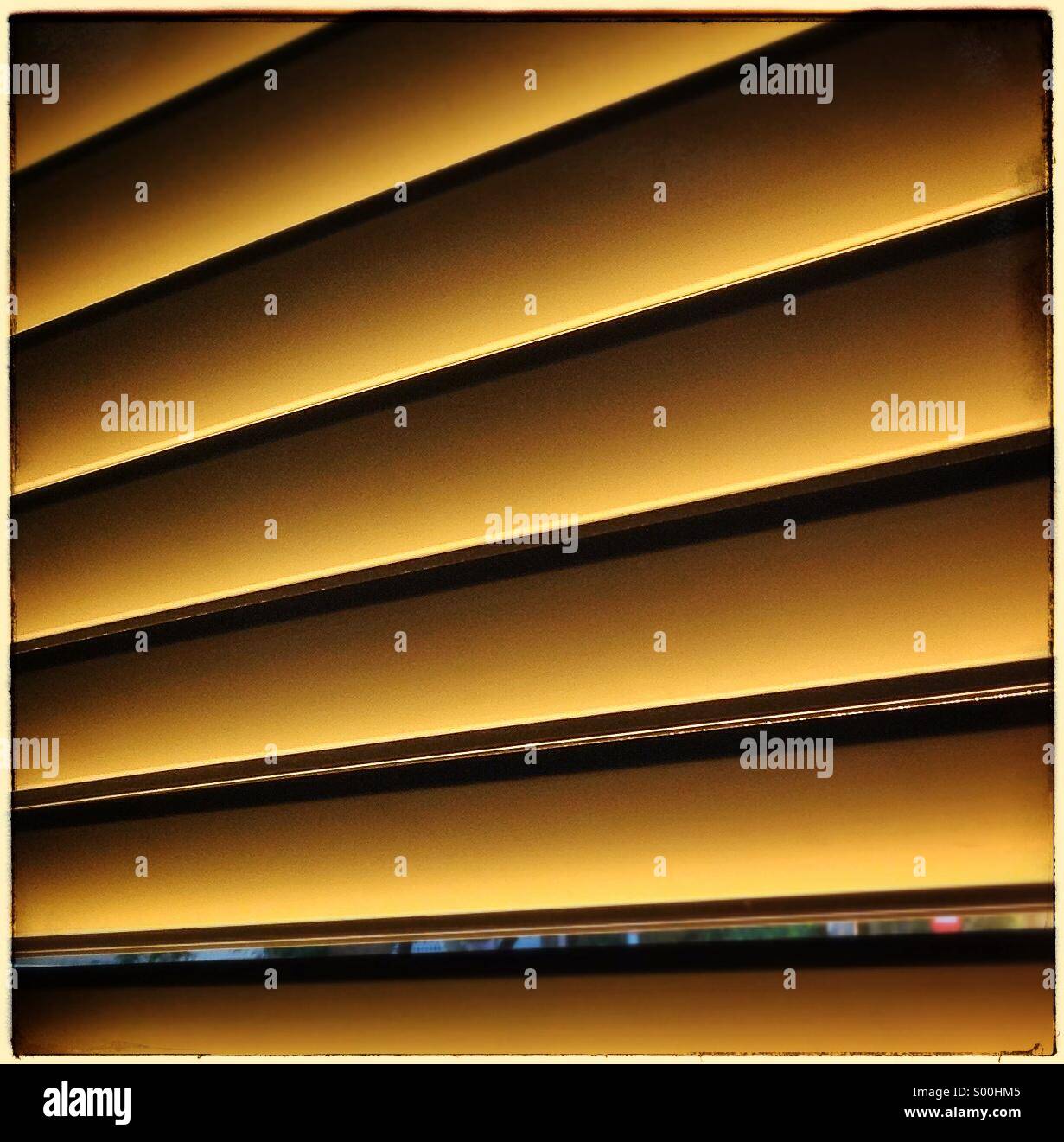 Morning spring sunlight streaming in a window shutters - Smartphone Captured Stock Image