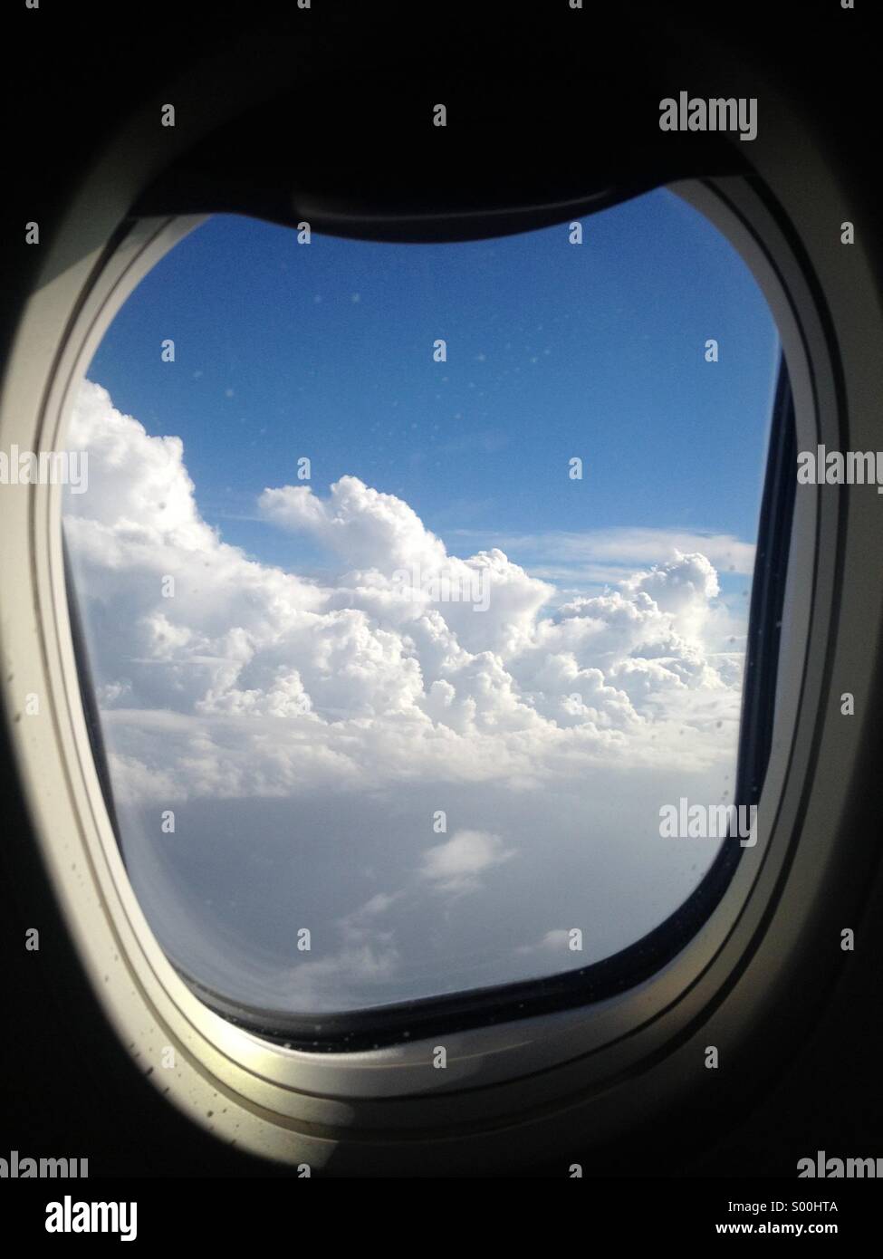 View of sky from inside jet aircraft. - Smartphone Captured Stock Image