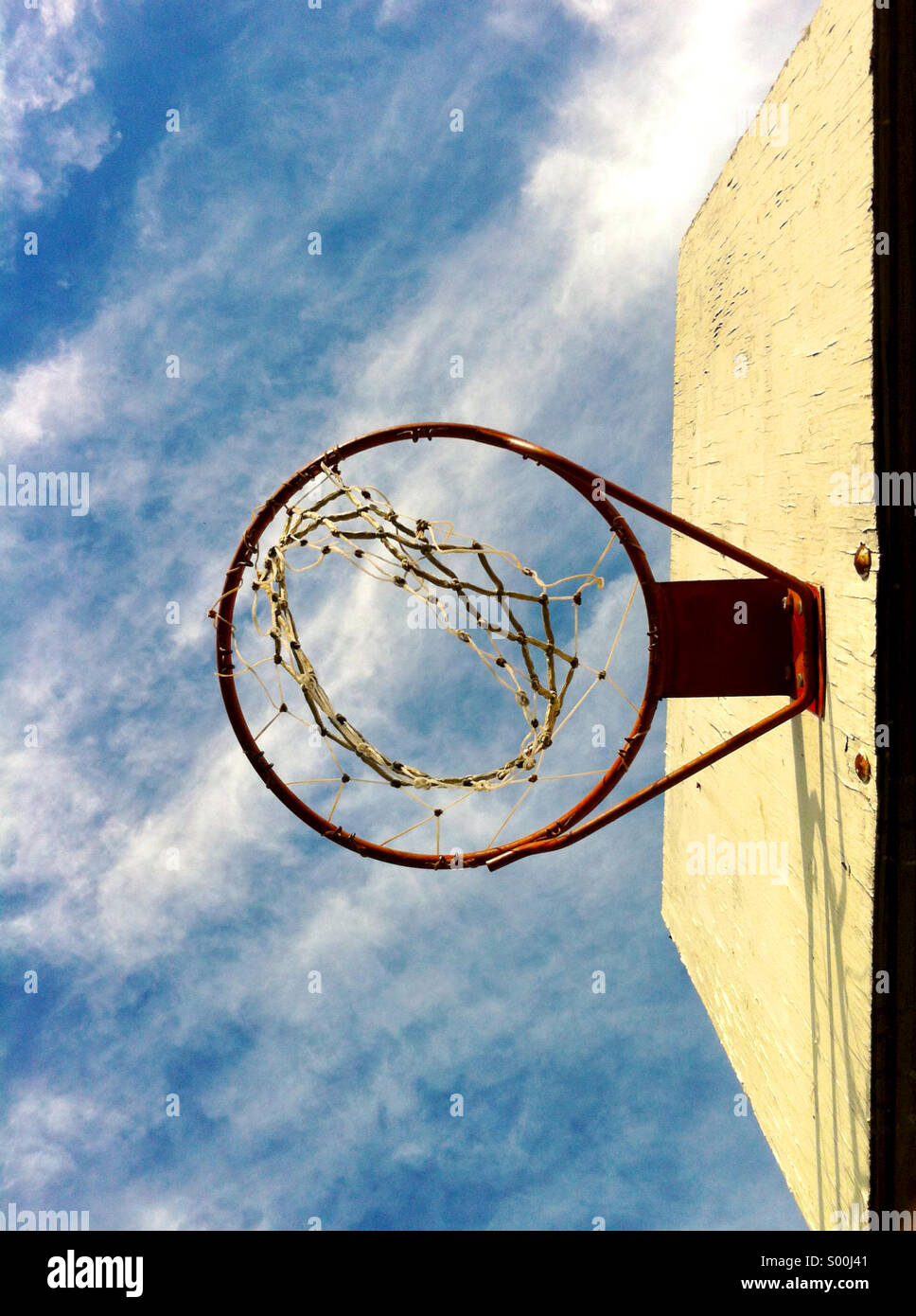 Looking up at a basketball hoop. Stock Photo