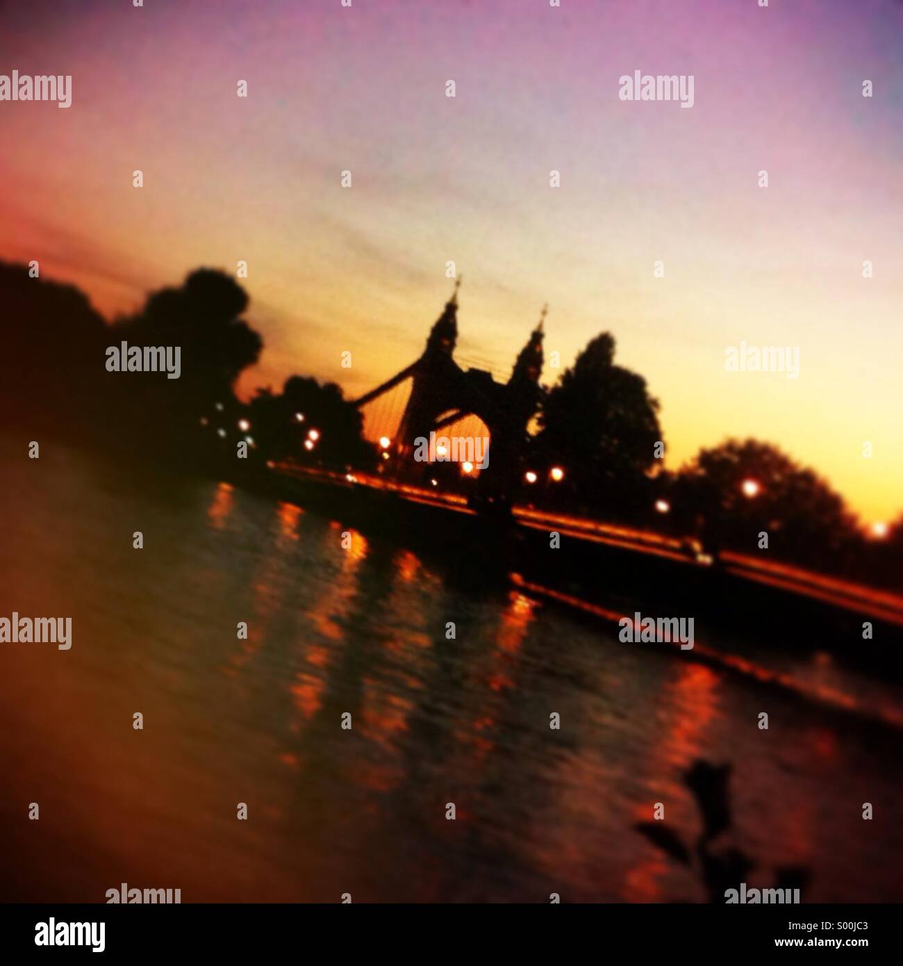 Hammersmith bridge at sunset. Stock Photo
