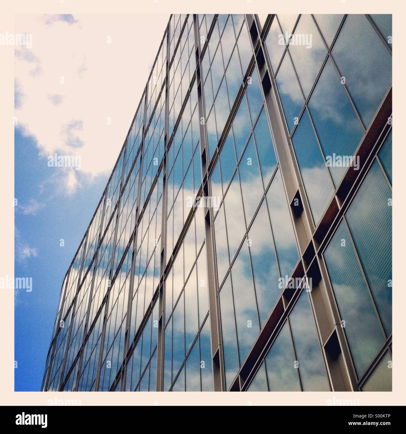 Sky reflected in a glass office building Stock Photo - Alamy