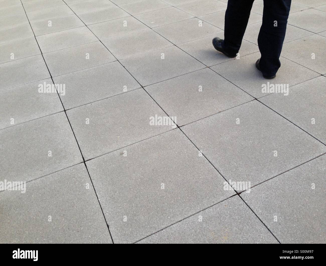 Man walking on square - Smartphone Captured Stock Image
