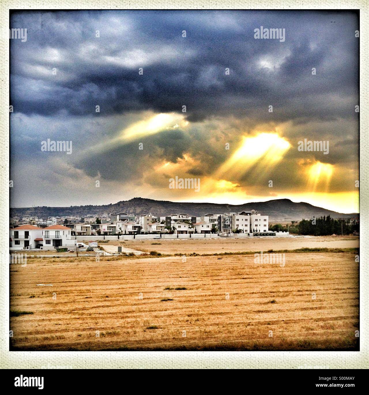 View towards Oriklini, Larnaca on Cyprus in dramatic late afternoon light. - Smartphone Captured Stock Image