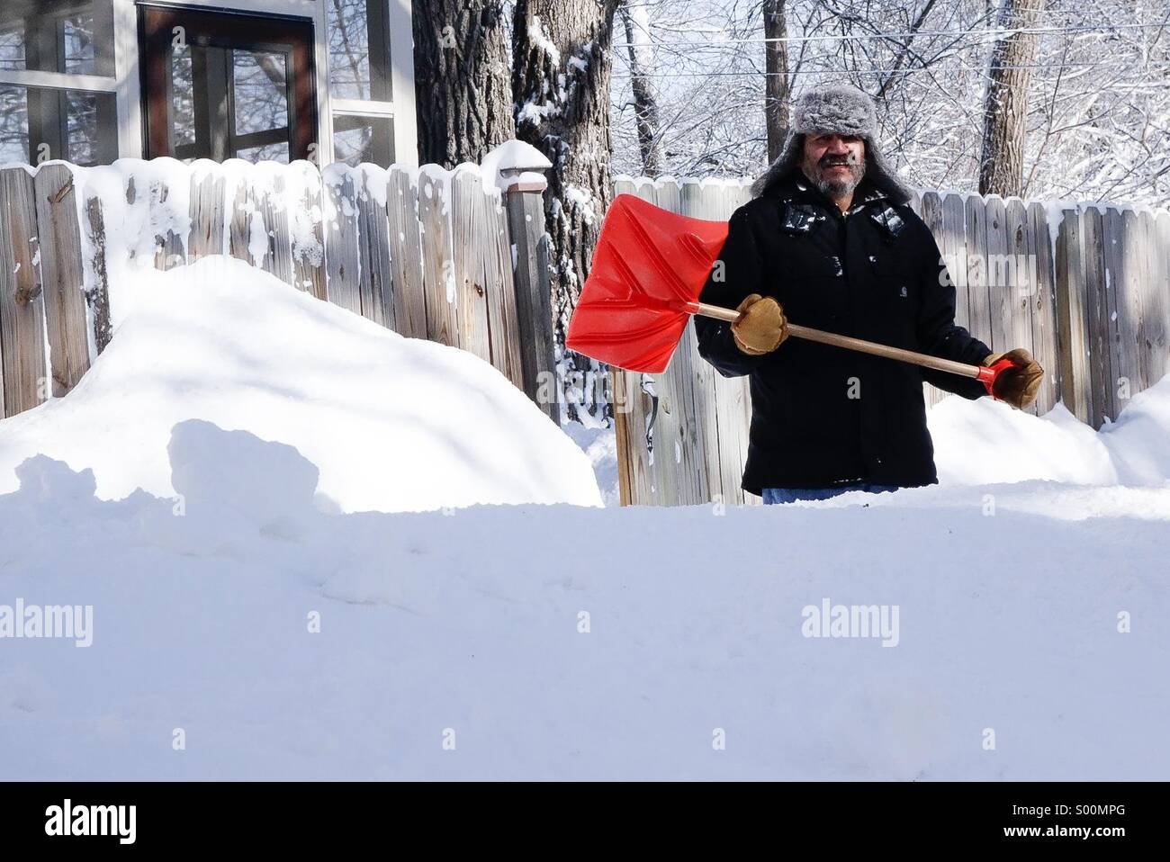 Snow removal with a shovel Stock Photo
