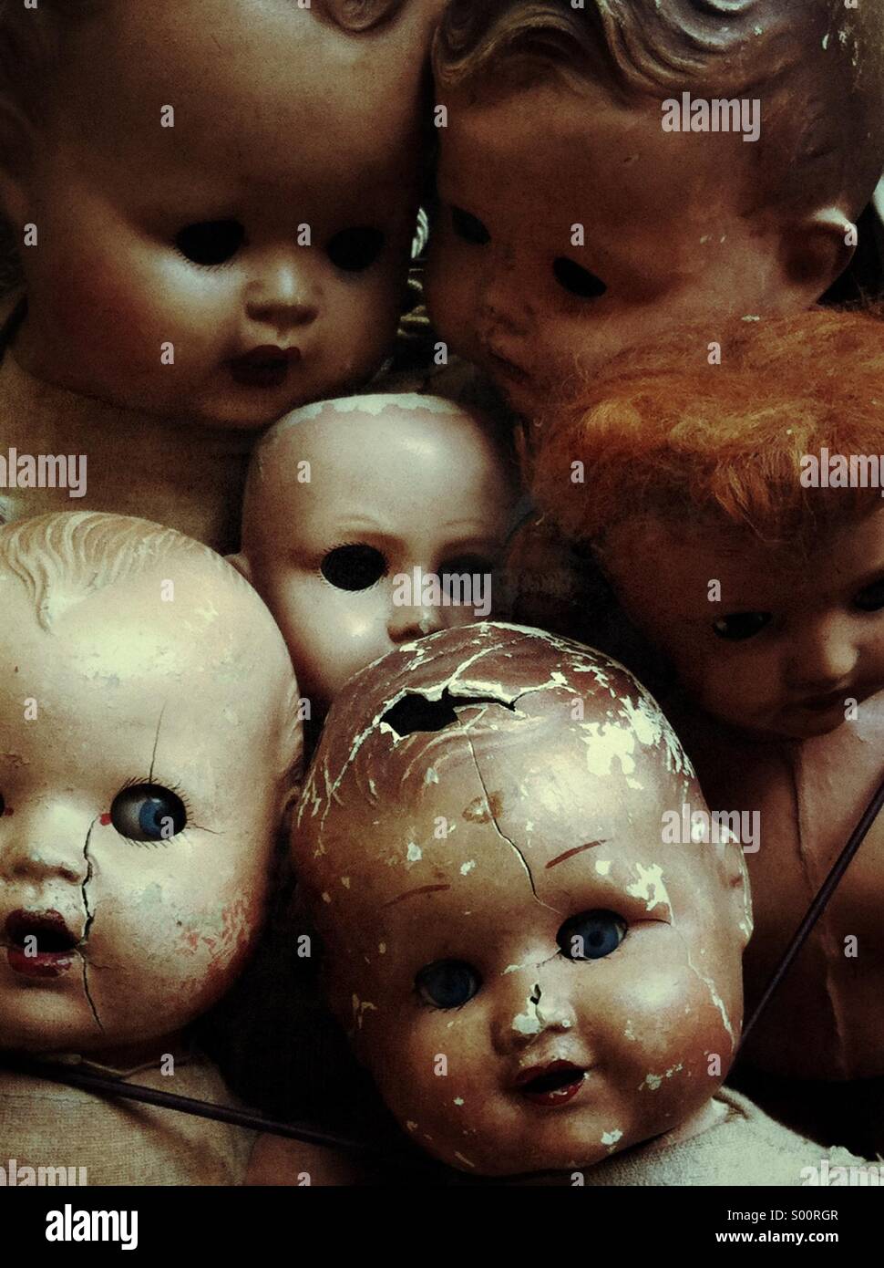 Old dolls on the market in San Telmo in Buenos Aires. - Smartphone Captured Stock Image