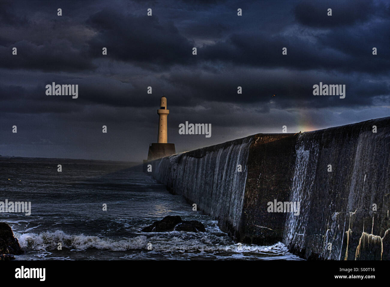 Lighthouse in Aberdeen dramatic sky and lighting on a stormy day Stock Photo
