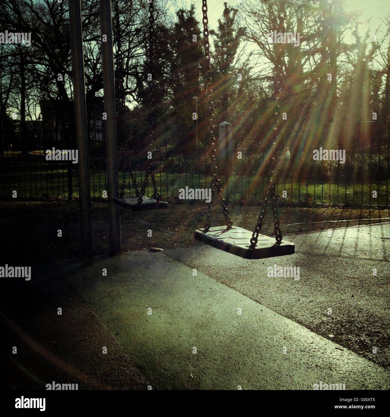 Empty swing in a playground - Smartphone Captured Stock Image