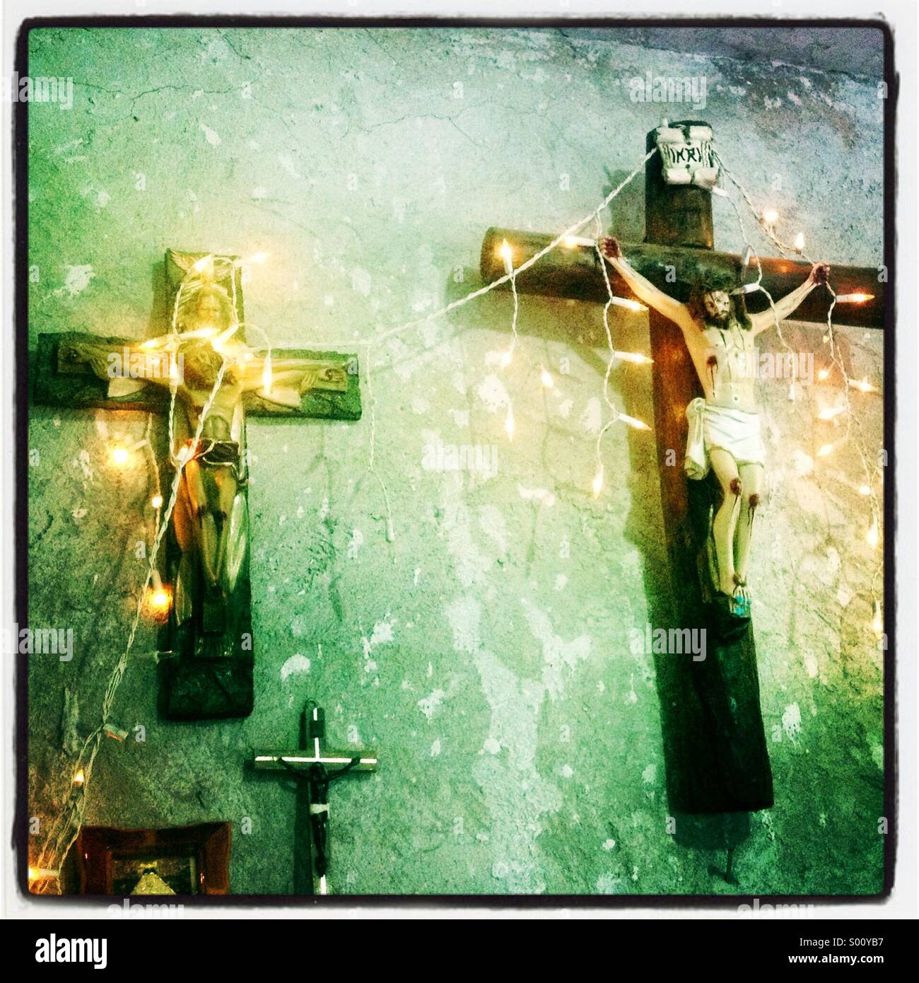 Christmas lights decorate two crosses during Day of the Dead celebrations in Teotitlan del Valle, Oaxaca, Mexico - Smartphone Captured Stock Image