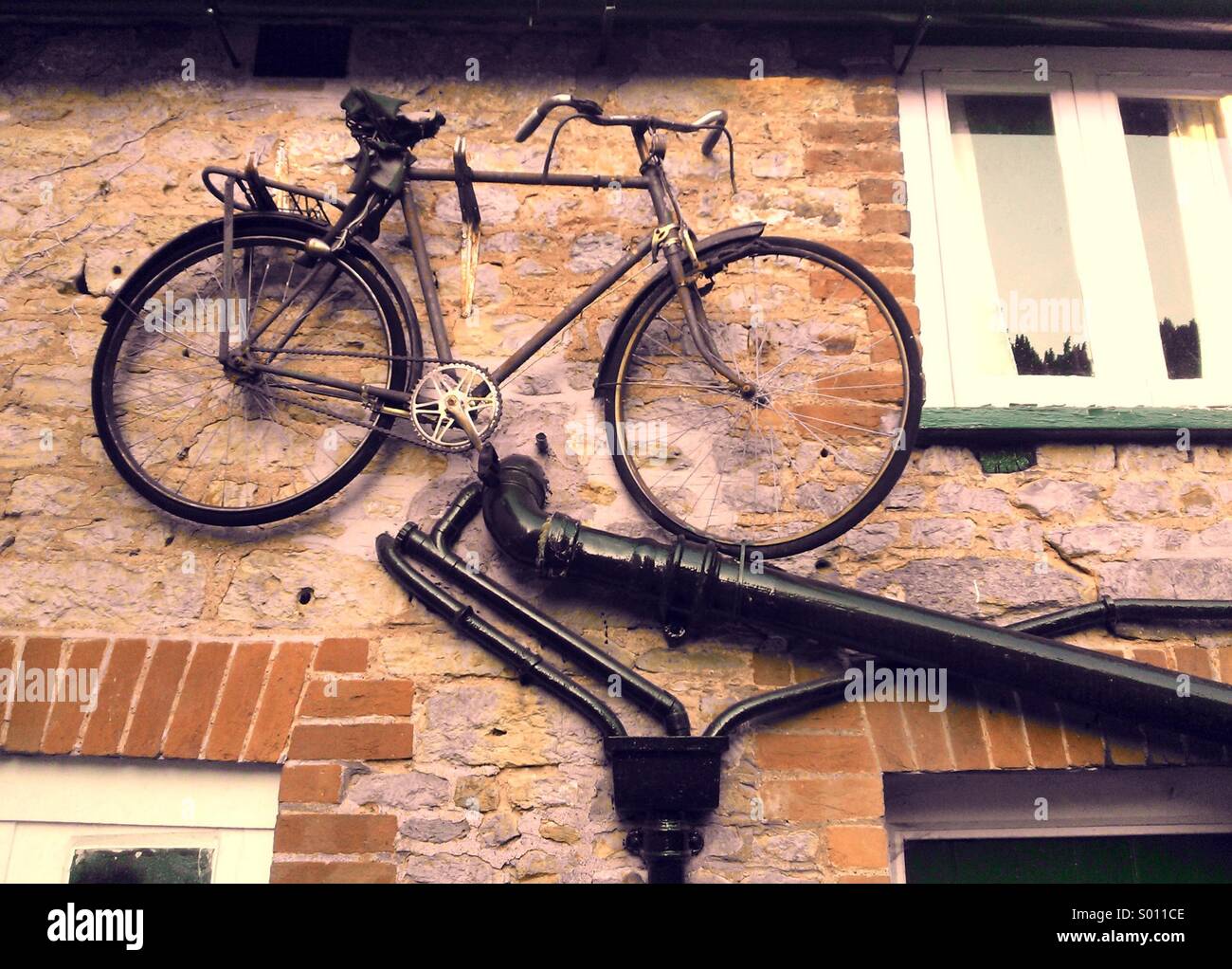 Old bicycle on a wall. - Smartphone Captured Stock Image Old bicycle on a wall. - Smartphone Captured Stock Image